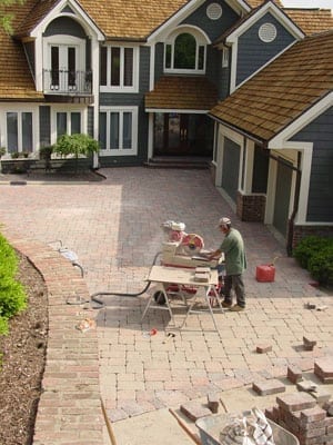 Paver Rescue team repairing large paver driveway